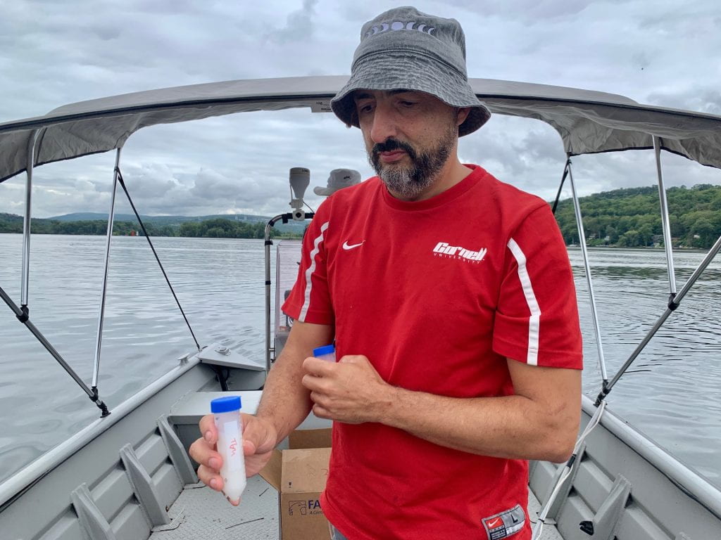 Jose Andres with Cayuga Lake (NY) water sample for eDNA study.